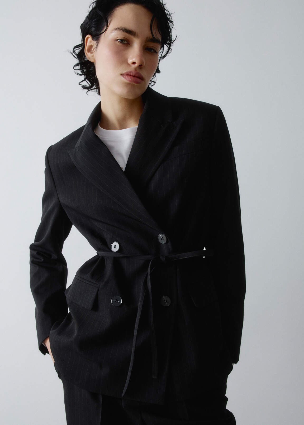 Double-breasted striped jacket with a thin belt